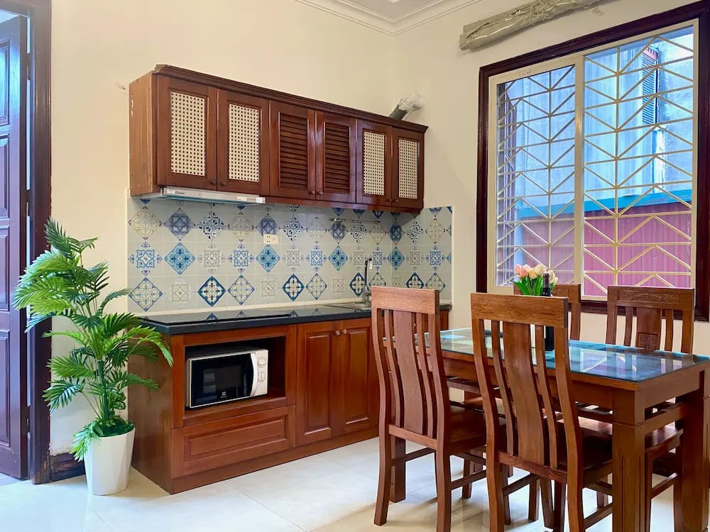 Bright and fully equipped kitchen with modern appliances for comfortable long stays in Hanoi.