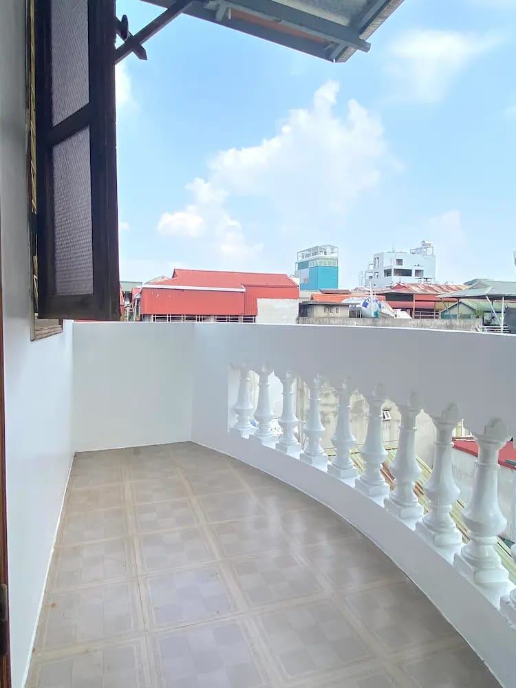 Private balcony with open city views and fresh air.