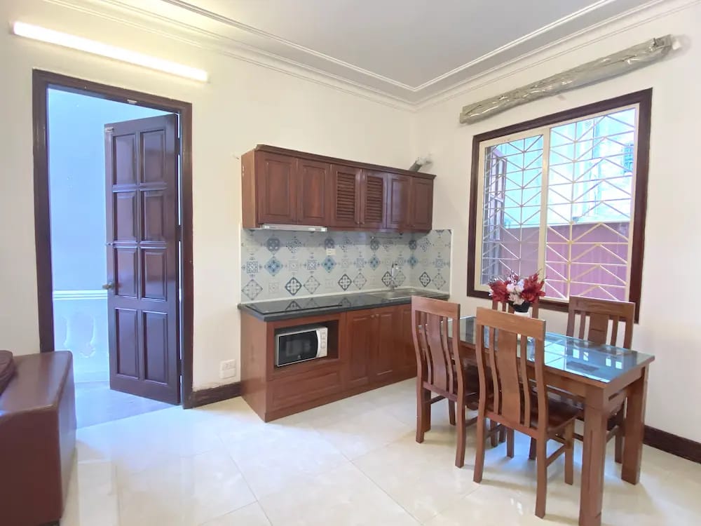 Bright and fully equipped kitchen with modern appliances for comfortable long stays in Hanoi.